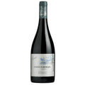 A bottle of Casas del Bosque Reserva Syrah red wine on a solid white background. The bottle is dark glass with a silver label featuring a blue bird and tree illustration, and a dark grey capsule at the top.