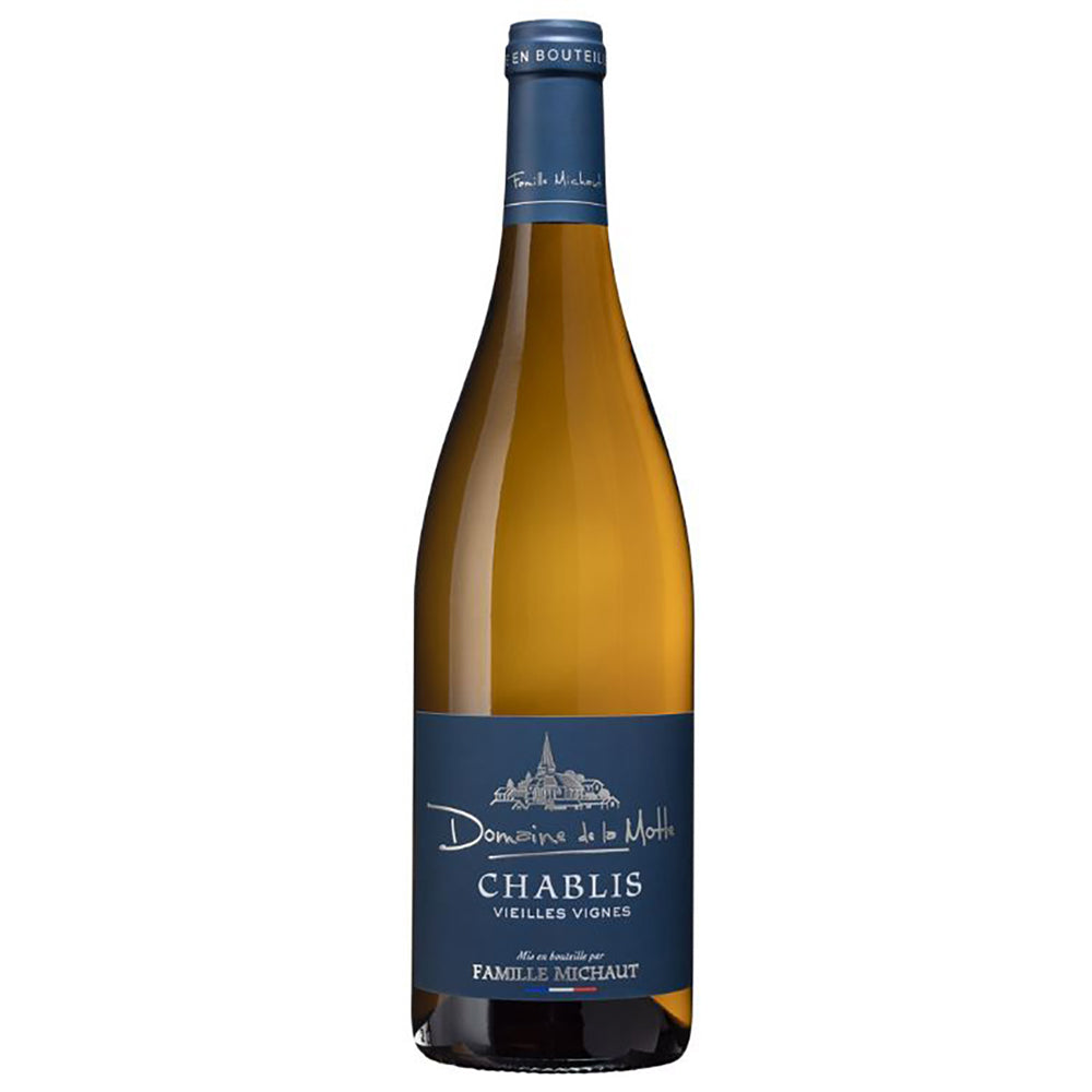 A bottle of Domaine de la Motte Vieilles Vignes Chablis. It has a blue label with silver writing and a blue foil capsule.