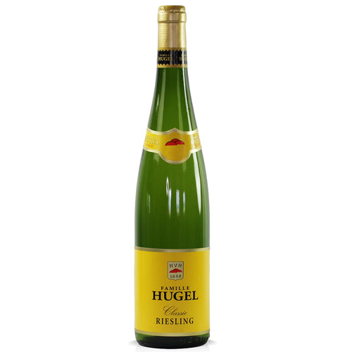A bottle of Hugel Classic Riesling. The bottle is green with a yellow label and gold foil capsule. All set on a white background