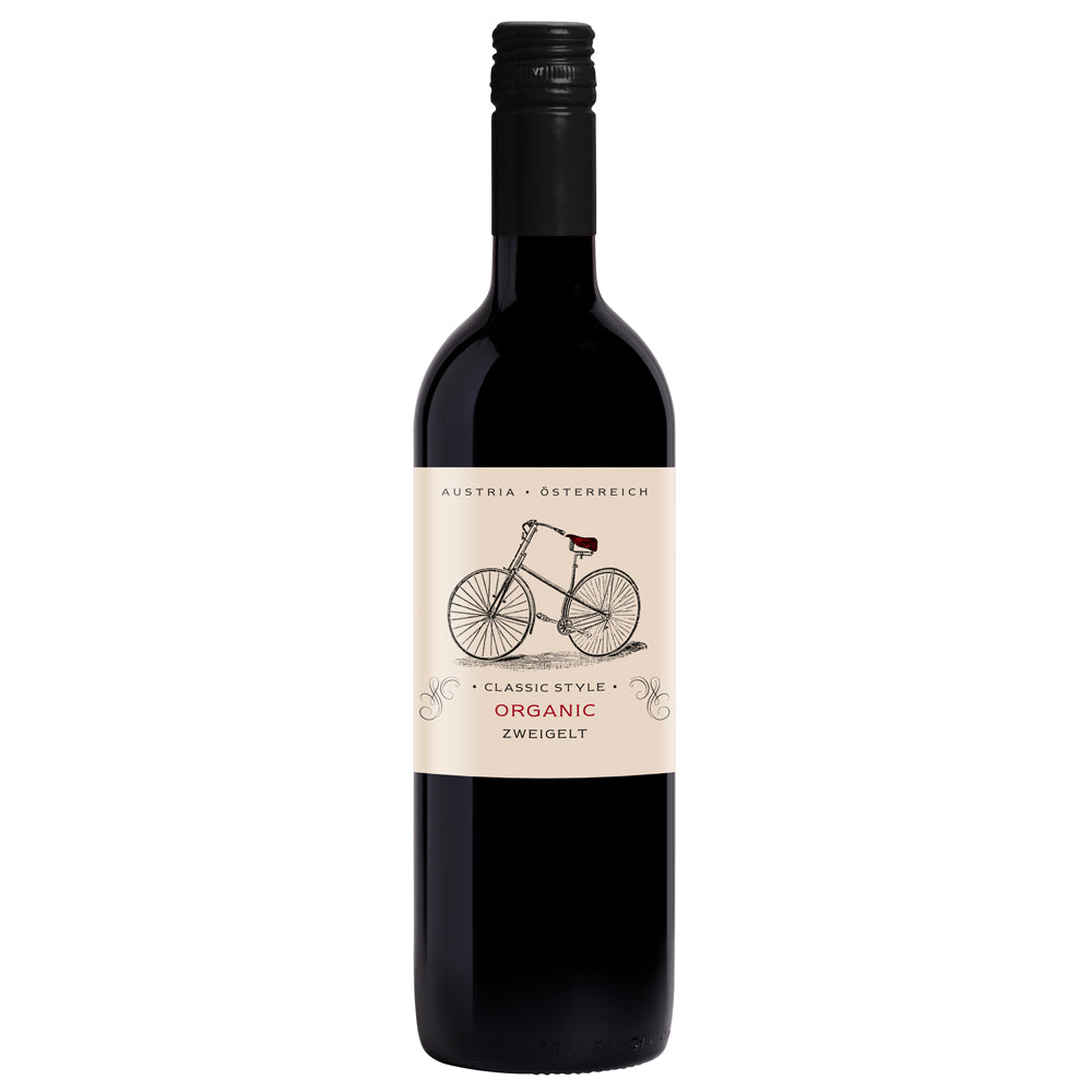 A bottle of Moser organic Zweigelt red wine from Austria, featuring a dark glass bottle with a cream-coloured label illustrated with a bicycle.