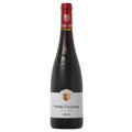 A bottle of Pierre Chainier Chinon red wine. There is a wihite label, with a re foil capsule and is set on a white background.