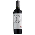 A bottle of Tabalí DOM red wine with a white label featuring black minimalist lettering and a small red diamond logo, set against a plain white background.