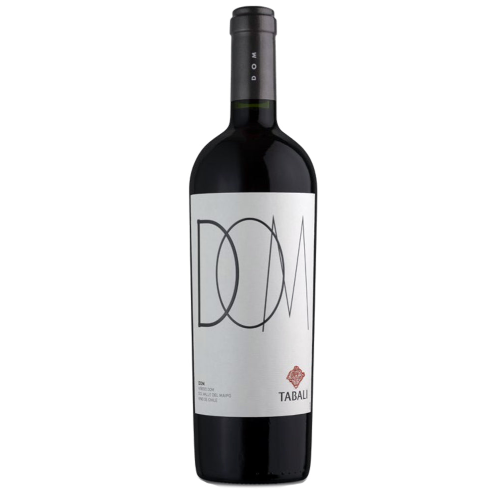 A bottle of Tabalí DOM red wine with a white label featuring black minimalist lettering and a small red diamond logo, set against a plain white background.