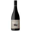 A bottle of The Hedonist Shiraz red wine. It has a grey label with red and white writing and the image of a pig. It has a black screw cap.