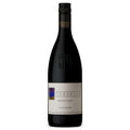 Wine bottle of Torbreck Cuvee Juveniles Australian red wine. It has a white label and black screw cap all on a white background.