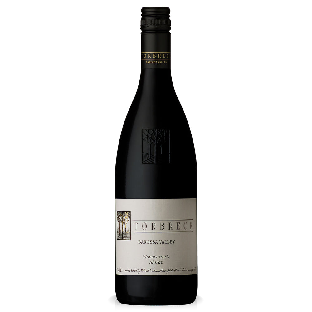 A bottle of Torbreck Woodcutter's Shiraz red wine, featuring a dark glass bottle with a cream-coloured label and a dark olive-green capsule, isolated on a white background.